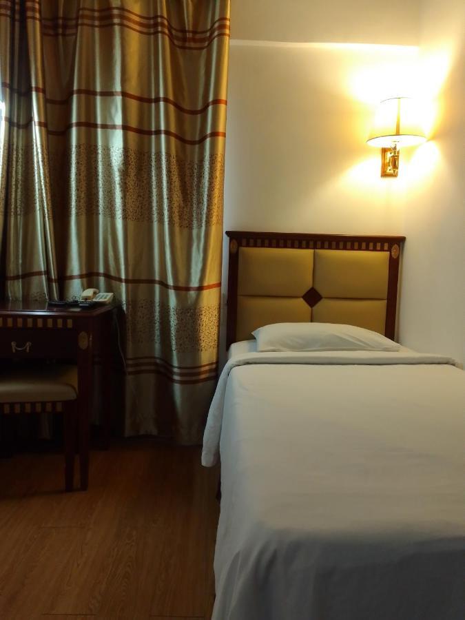 Super Oyo 90464 Borneo Suites Hotel Kota Kinabalu Kültér fotó